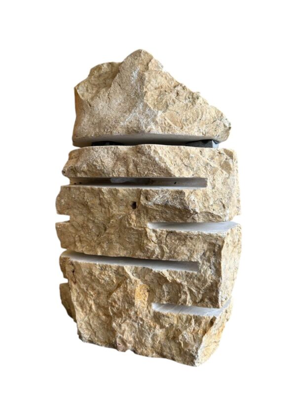 Layered natural stone garden lamp with rough texture and horizontal light slits