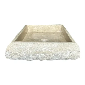 Handmade squared marble sink with polished interior and natural rough exterior.
