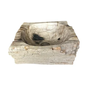 Rectangular hand-carved petrified wood wash basin with natural rustic exterior and smooth polished interior.