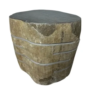 Handmade river stone coffee table with smooth top and carved natural textured sides.