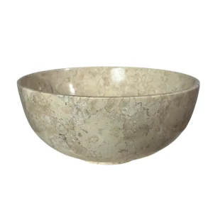 Handmade round marble bowl with smooth polished surface and natural beige veining.