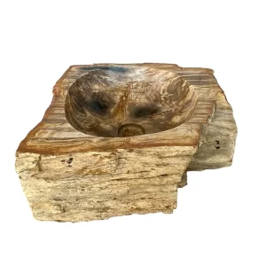 Rectangular hand-carved petrified wood wash basin with natural rustic exterior and smooth polished interior.