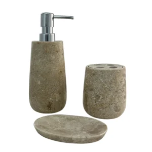Handcrafted beige marble bath accessories set with soap dispenser, tumbler, and soap dish in natural stone finish.
