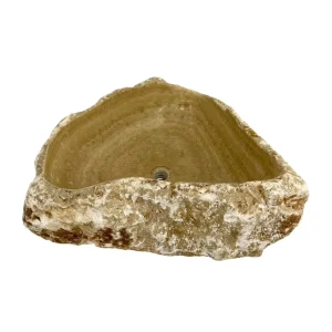 Natural onyx bathroom sink with polished interior and rustic raw stone exterior