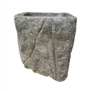 Marble sink with rough texture.