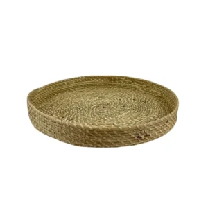 Handwoven natural fiber basket with handles made from organic materials
