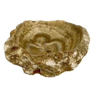 Natural onyx bathroom sink with polished interior and rustic raw stone exterior