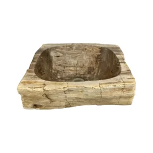 Hand-carved petrified wood wash basin with natural rustic exterior and smooth polished interior.